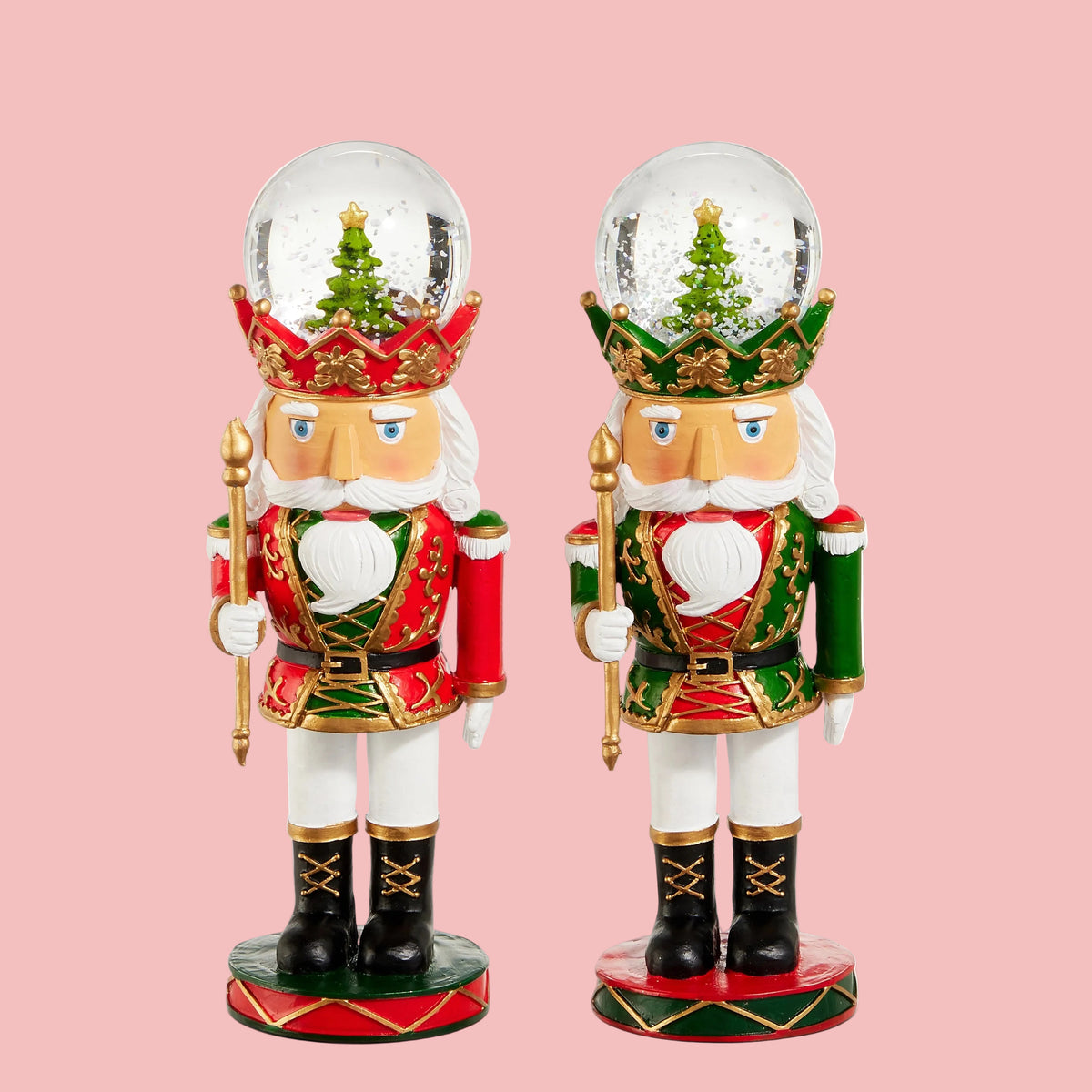 nutcracker figurines with snow globes on their heads